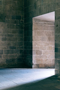 View of brick wall with building