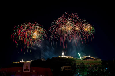 Low angle view of firework display at night