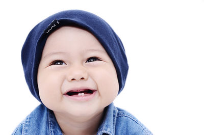 Portrait of cute baby against white background