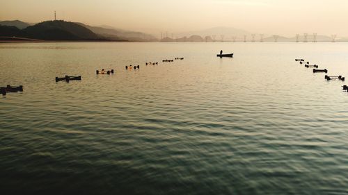 Scenic view of lake at sunset