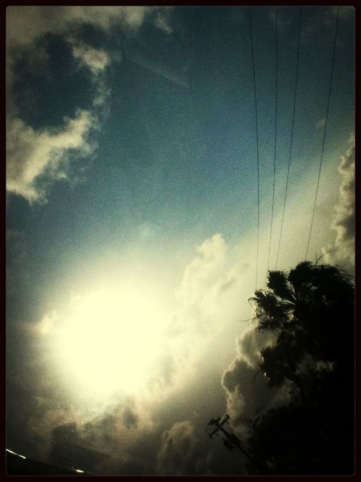 transfer print, low angle view, sky, auto post production filter, cloud - sky, tree, power line, nature, beauty in nature, tranquility, cloudy, cloud, scenics, sunlight, tranquil scene, silhouette, outdoors, no people, day, sunbeam