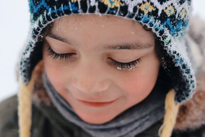 Close-up portrait of girl in snow