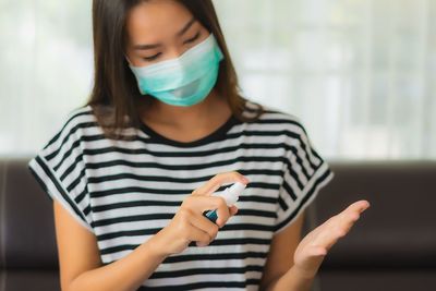 Portrait of woman holding mobile phone