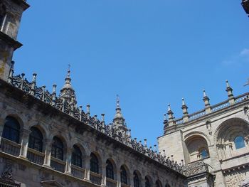 Low angle view of historical building against clear blue sky