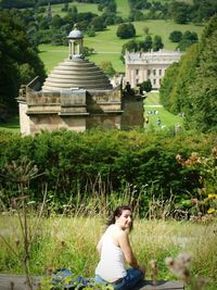 Portrait of woman against plants