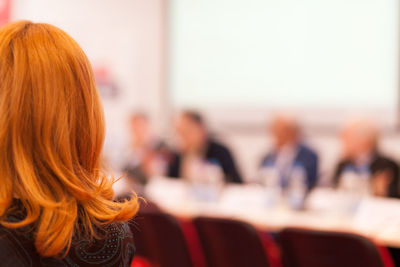 Rear view of redhead woman