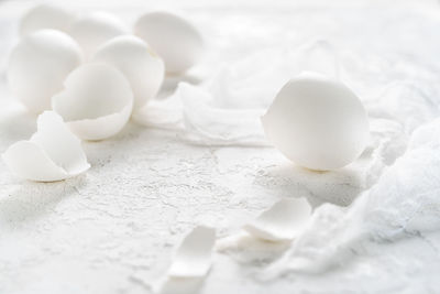 Close-up of broken egg shells on table