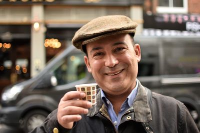 Portrait of smiling man in city