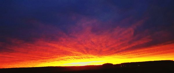 Silhouette of landscape against dramatic sky