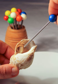 Close-up of person hand holding candies