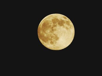 Low angle view of moon against clear sky at night