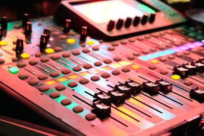 Closeup of an audio mixing control panel