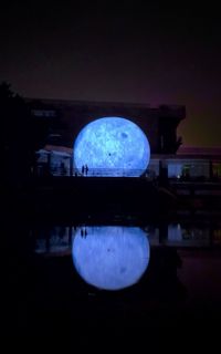 Reflection of illuminated buildings in water