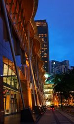 Low angle view of illuminated buildings at night