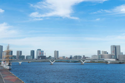 Sea and buildings against sky