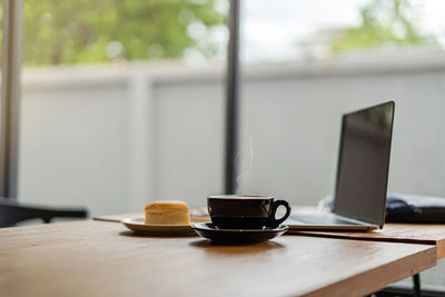 Coffee cup on table