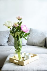 Flower vase on table at home