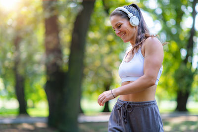 Young woman standing in park