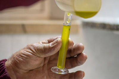 Close-up of hand holding drink