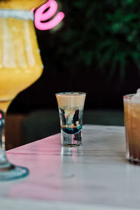 Close-up of beer glass on table