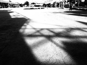 Shadow of people on street