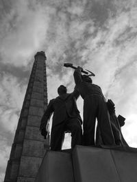 Low angle view of statue against sky