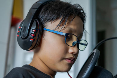 Close-up portrait of boy wearing eyeglasses