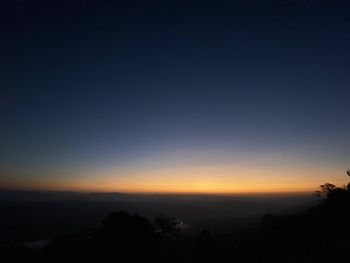 Scenic view of silhouette landscape against clear sky at sunset