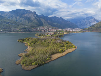 Scenic view of sea and mountains against sky