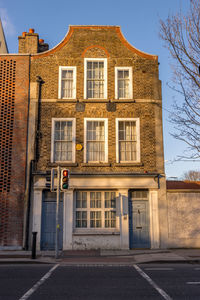 Building by road against sky