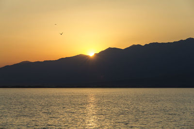 Scenic view of sea against sky during sunset