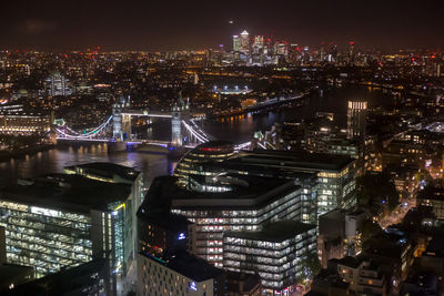 Aerial view of illuminated city at night