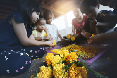 High angle view of people holding toys