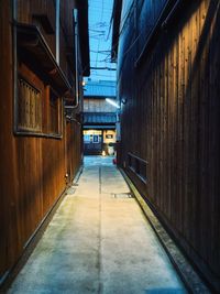 Empty alley amidst buildings in city