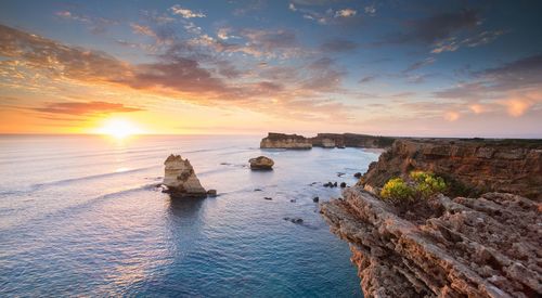 Scenic view of sea against sky at sunset