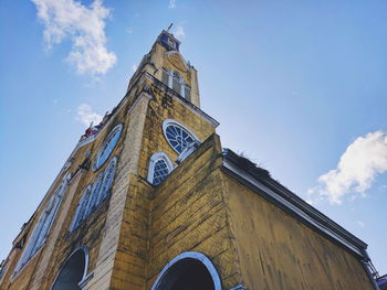 Low angle view of clock tower against sky