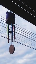 Low angle view of hanging against sky