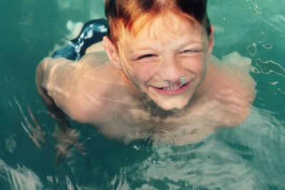 Portrait of young boy underwater