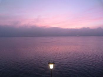 Scenic view of sea against sky at sunset