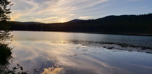 Scenic view of lake against sky during sunset