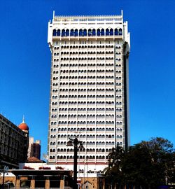 Low angle view of building against blue sky