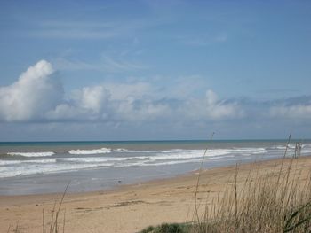 Scenic view of beach against sky