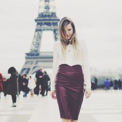 Woman with umbrella in the background