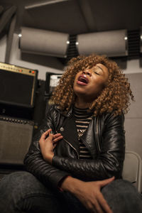 Singer performing in a recording studio