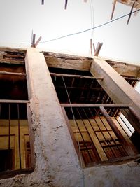 Low angle view of abandoned building against sky