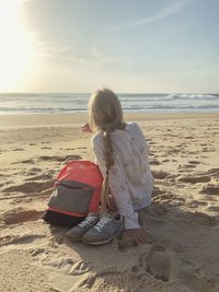 Rear view of woman on beach