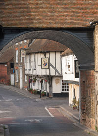 Road by buildings in city