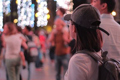 Rear view of crowd in city at night