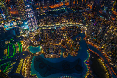 High angle view of illuminated buildings in city at night