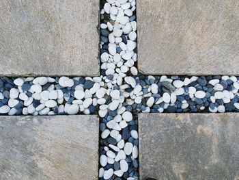 High angle view of stones in cross shape